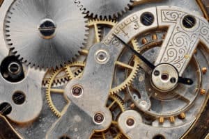 gears of a vintage clock machinery, close up