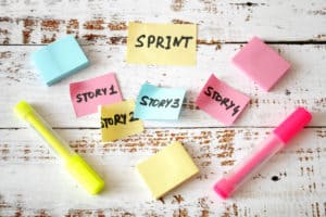 Sticky notes on wood representing a stylized Sprint backlog.jpeg