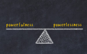 Balance between powerfulness and powerlessness. Chalkboard drawi