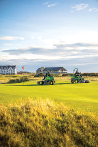 John Deere equipment grooming a golf course