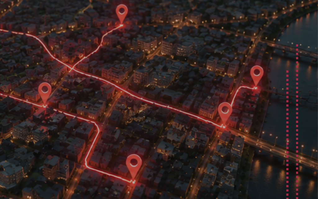 Aerial night view of a city with glowing red route lines connecting five location pin markers, overlaid on illuminated streets and a river.